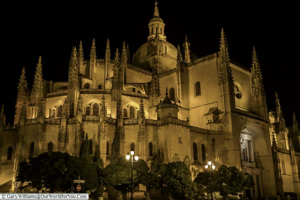 Segovia's cathedral illuminated at night.