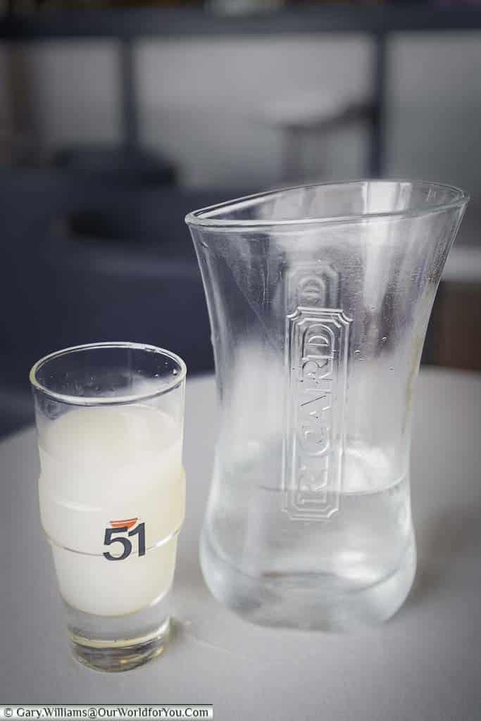 Glass of Richard served with a jug of water for you to mix as you desire. Once you mix the 2 clear liquids the resulting drink turns a cloudy whitish colour