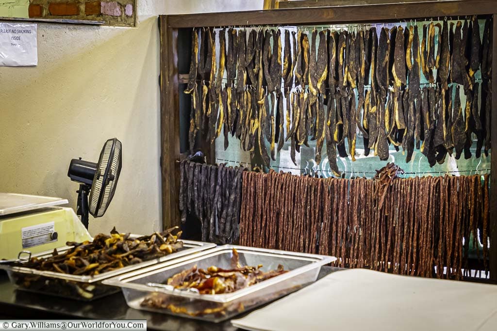 Rows of biltong hanging in the air at Saucy Sues, a stopover at Lions Den, on the road to Lake Kariba.