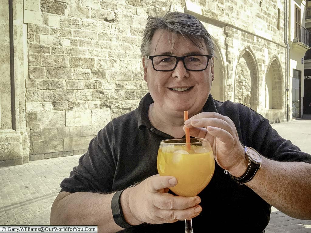 Gary with a large glass of Agua de Valencia in central Valencia, Spain