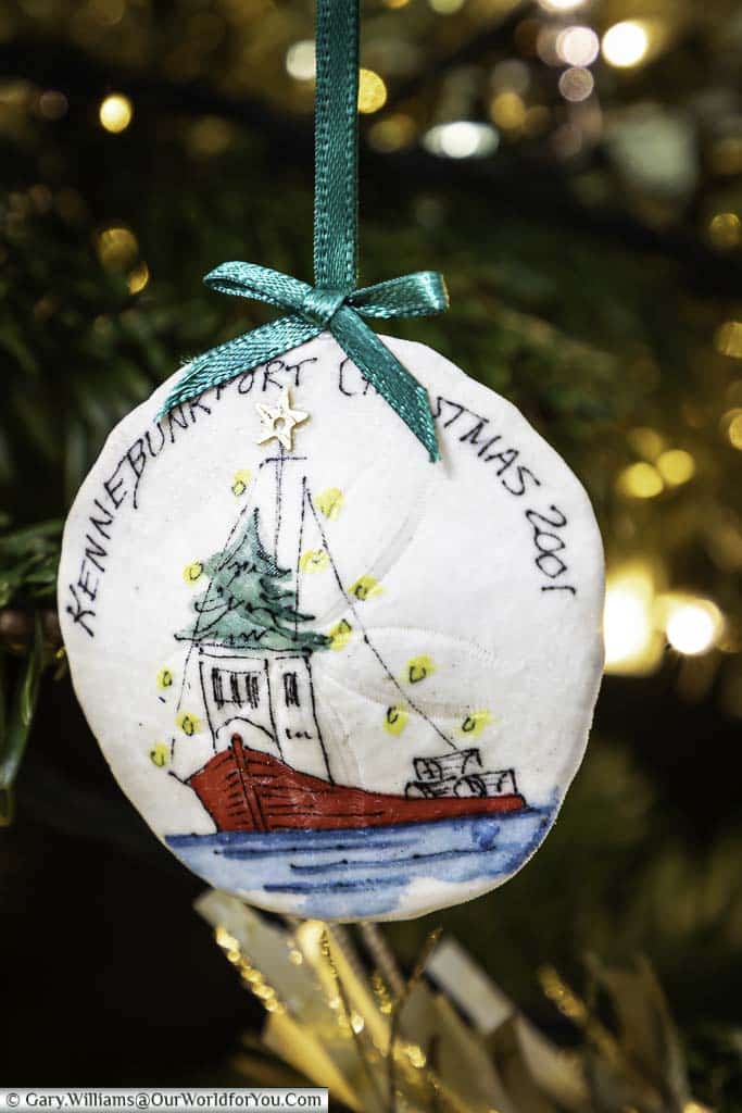 A painted clam shell christmas decoration from Kennybunkport hanging in our christmas tree