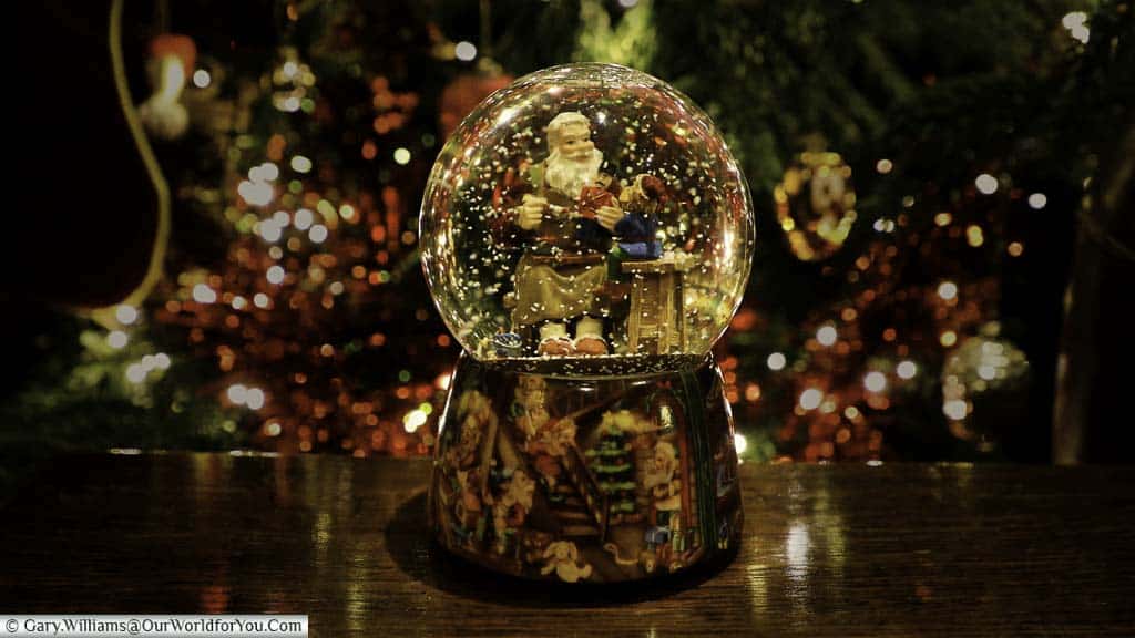 Our snowglobe, bought from strasbourg's christmas markets in front of our christmas tree as part of our festive decorations.