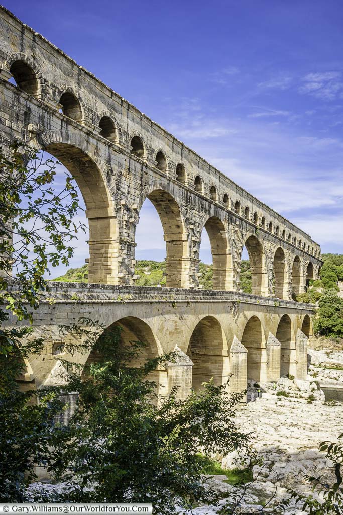 A side view of the three tiers of the roman stone aqueduct of pont du gard in southern france