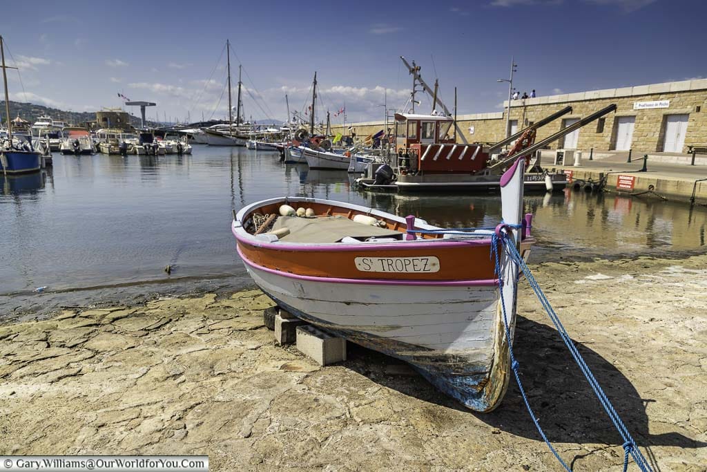 An old wooden fishing boat moored up the harbour of Saint Tropez on the French Riviera