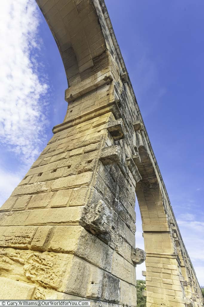 A close-up view of the stonework and the massive arches of the pont du gard in provence in southern france