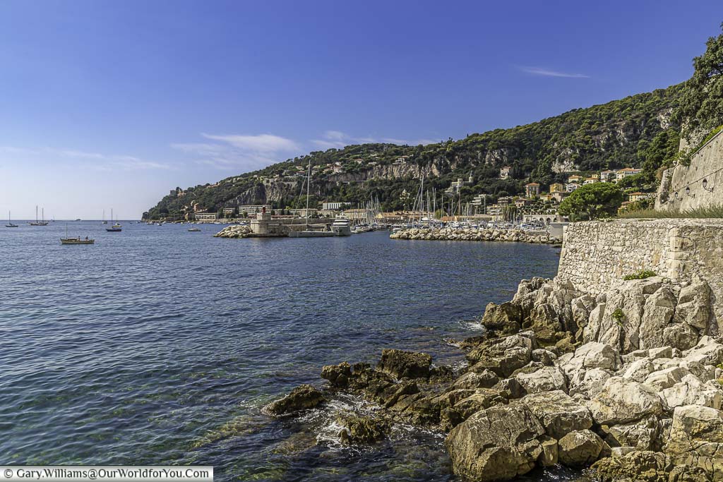 The view to the La Darse harbour in Villefranche-sur-Mer from the path that runs alongside the citadel wall.