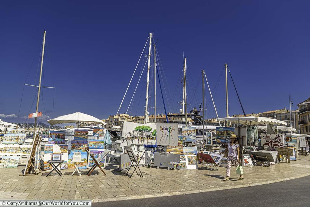 Artist stalls laid out on the quayside of st tropez in the south of france