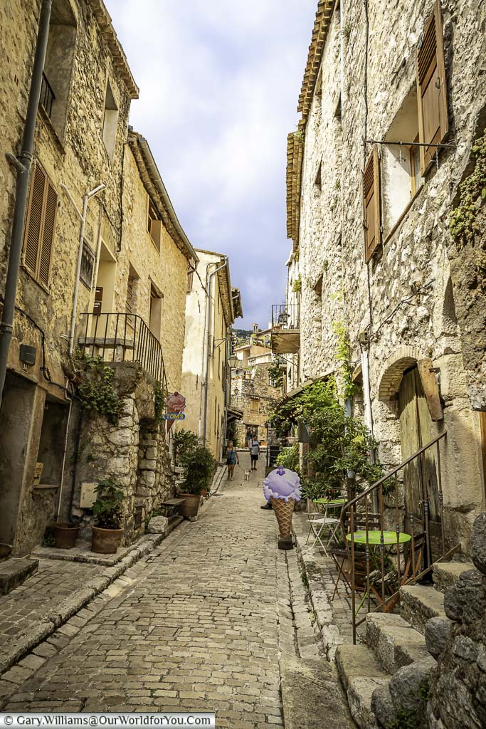 An ice cream shop along a small cobbled lane in the village of Tourrettes-sur-Loup in provence, france
