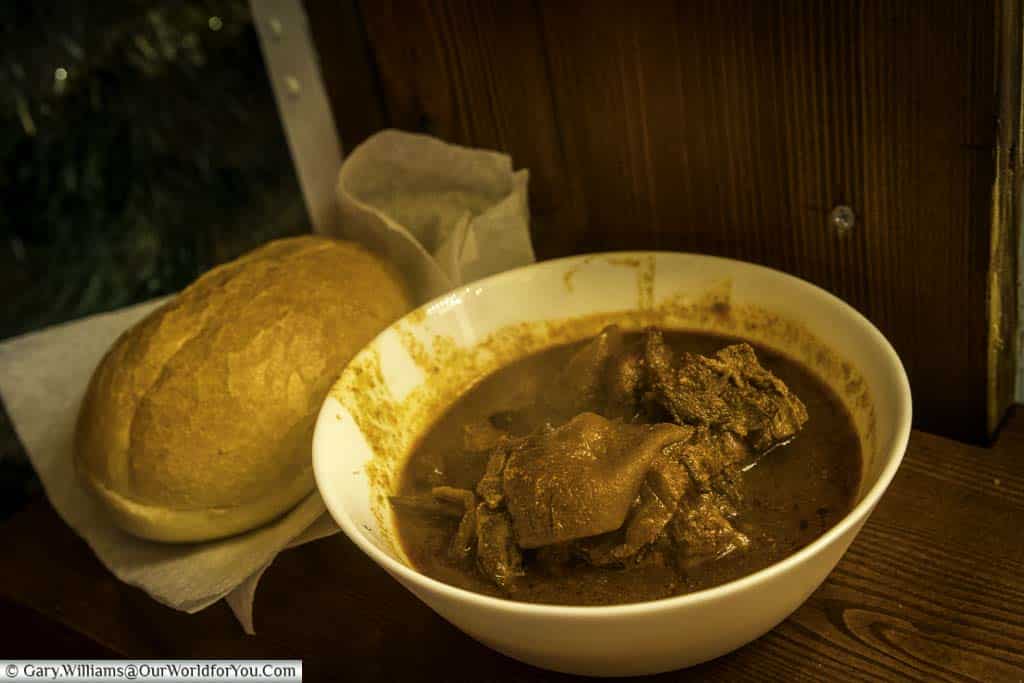 A bowl of steaming goulash soup and a crusty bread roll from Frankfurt’s Christmas markets