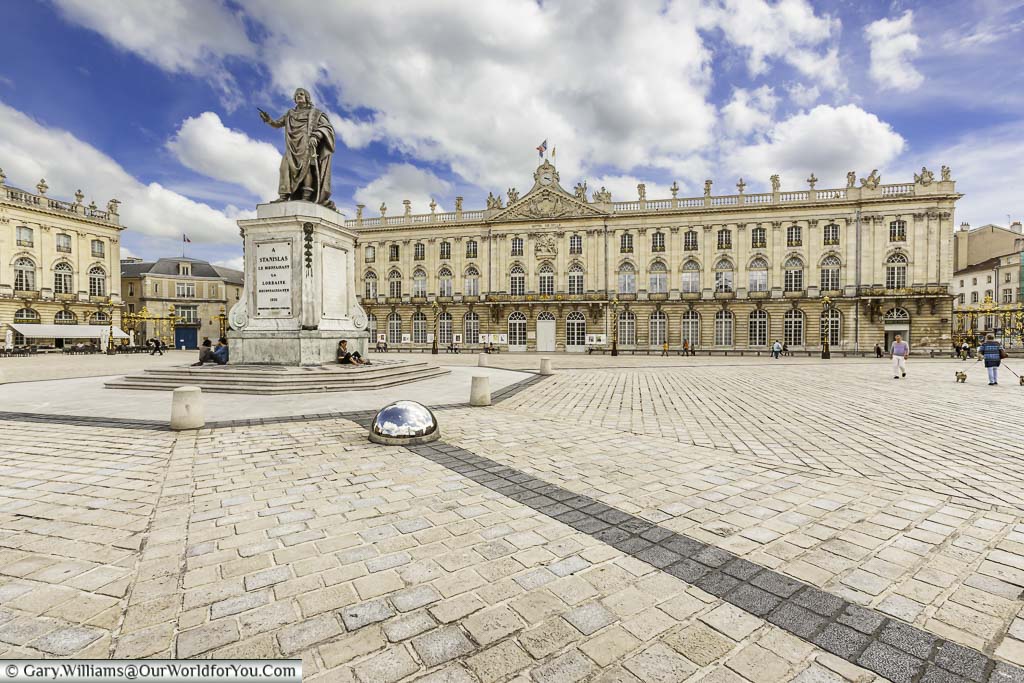 A statue in the centre of UNESCO place stanislas in nancy surrounded with 18th century buildings