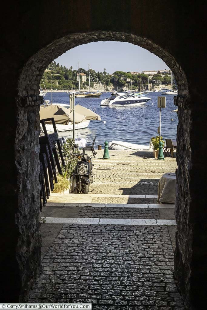 Looking through an arch to the bay of Villefranche-sur-Mer.
