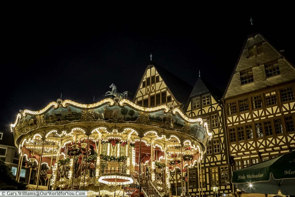 The brightly lit carousel in Frankfurt's Römerberg Christmas market