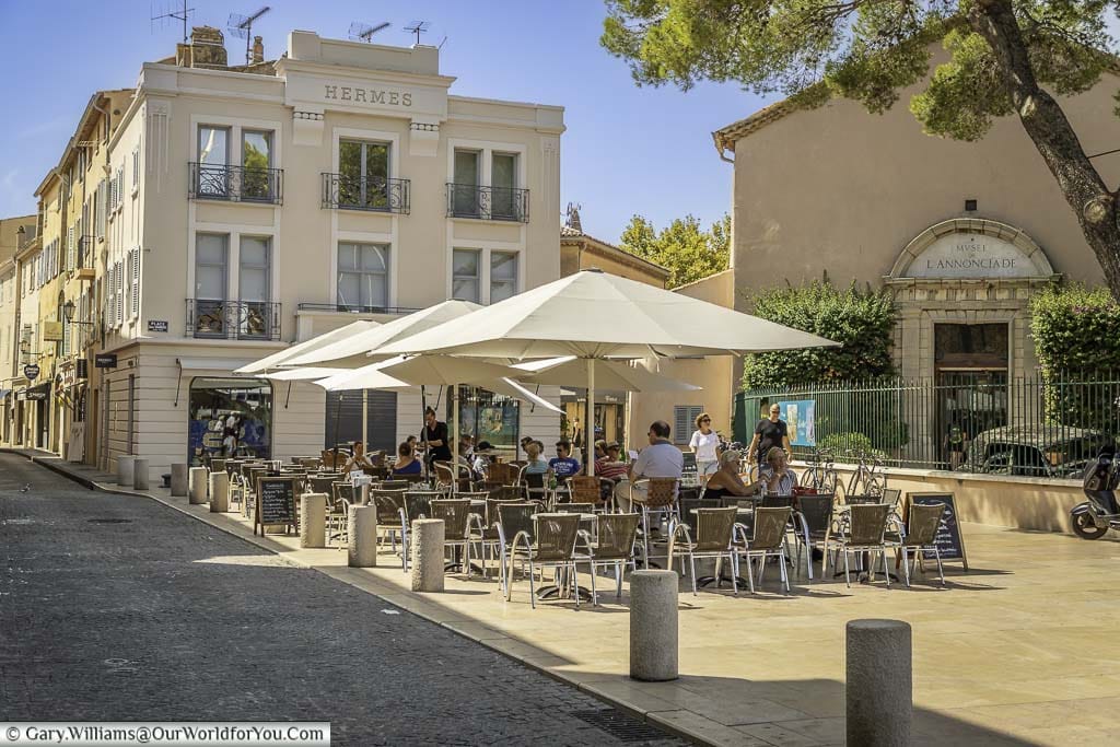 canopies over tables and chairs outside a restaurant in saint tropez in the south of france