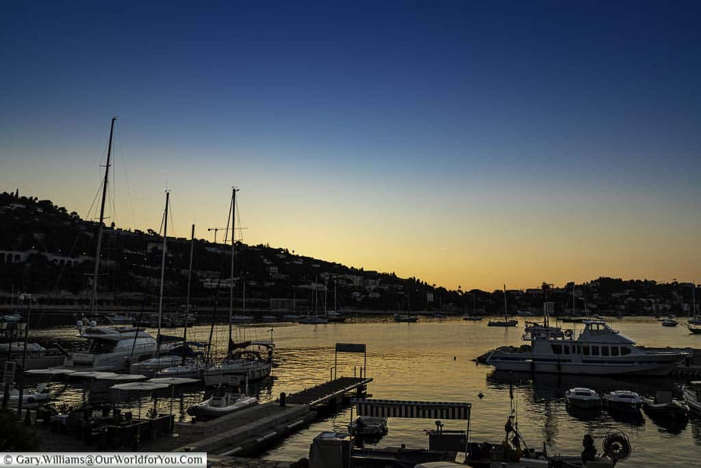 The view of sunrise over the bay from the balcony of our room at The Welcome hotel in Villefranche-sur-Mer