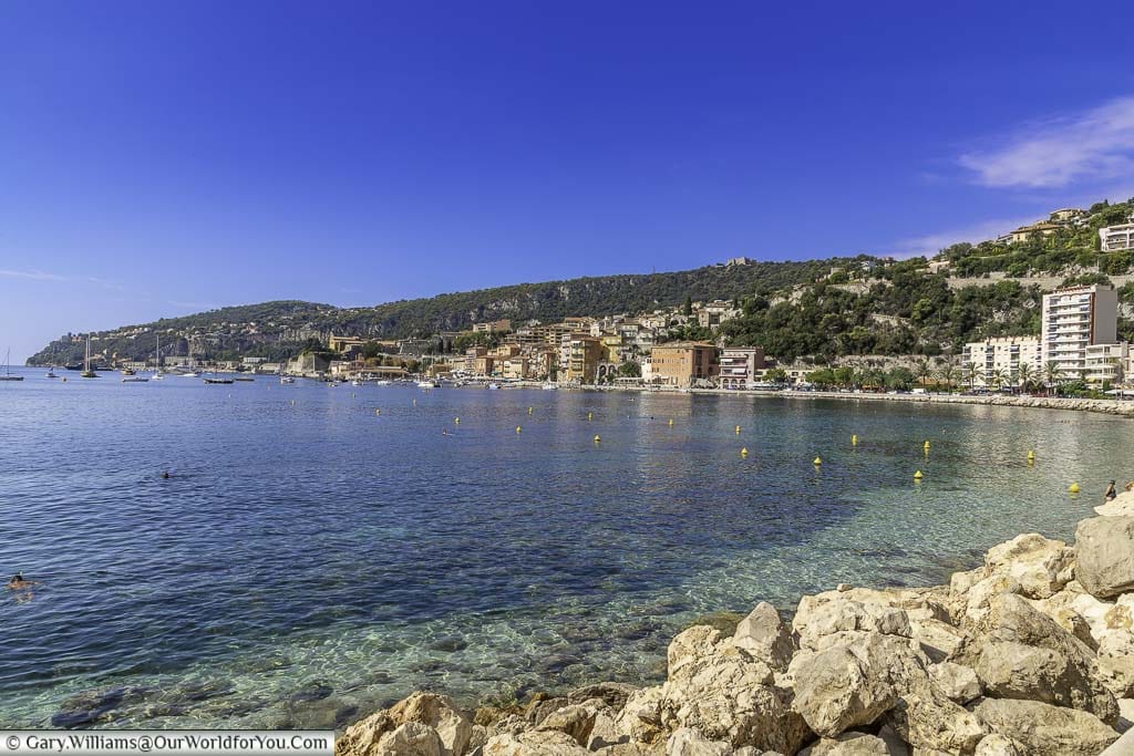 The view of the bay in front of Villefranche-sur-Mer lined from the beach