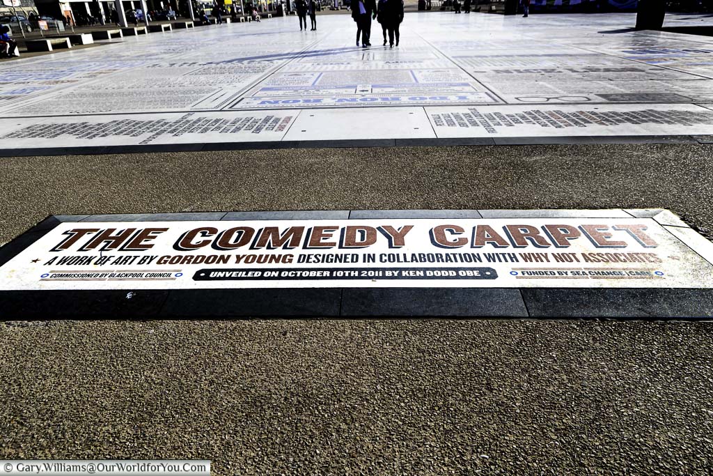 The edge of the 'Comedy Carpet' art installation; consisting of the names of comedians, and memorable comedy phrases, laid out in front of Blackpool Tower on Blackpool Promenade