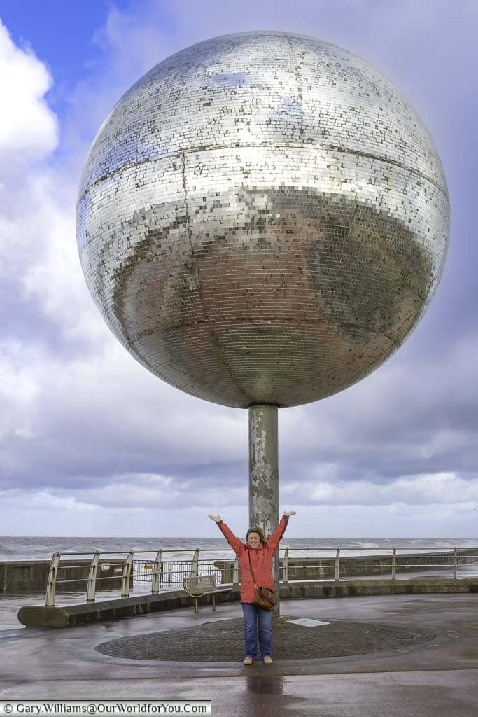 Janis stanging under the Giant Glitterball on Blackpools seafront on a crisp October's day.