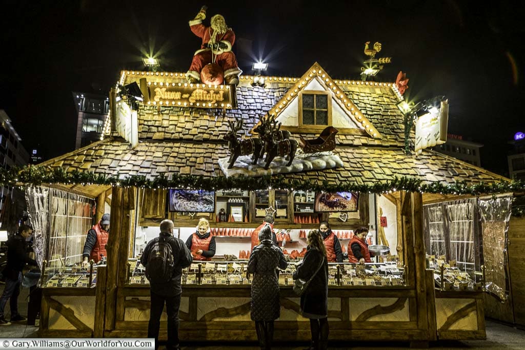 A stall on the Christmas markets selling roasted nuts that you literally can smell before you see. The wooden hut has a jolly Santa and his reindeer perched on the tiled roof.