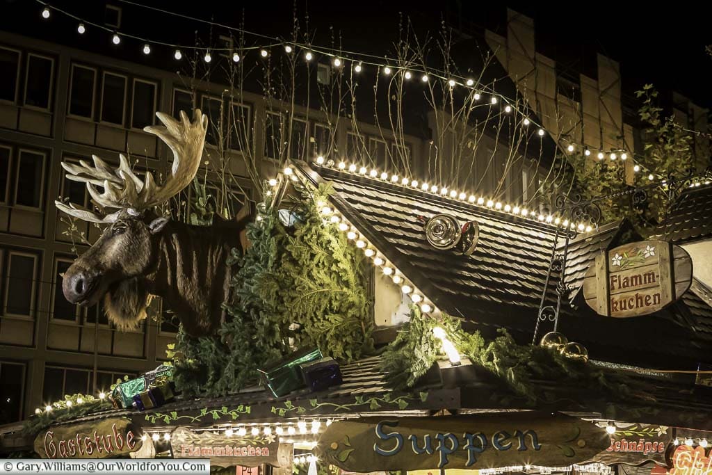 The top of a food stall on one of the Christmas markets with an animated Moose head that performs by singing classic Christmas songs like you've never heard before.