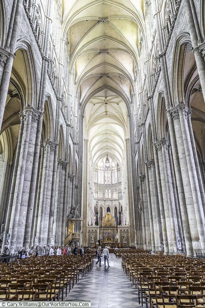 The view along the aisle of the high vaulted, UNESCO recognised, world heritage site of amiens cathedral.