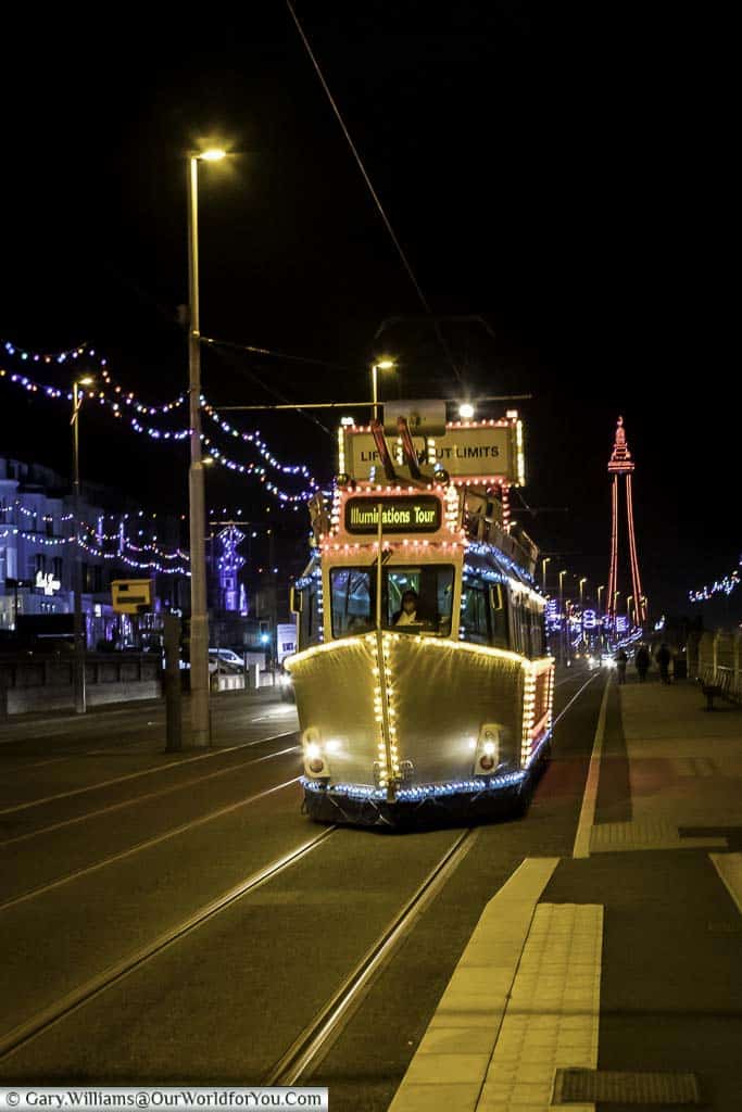 The Frigate Tram with the illuminated Blackpool Tower in the background.