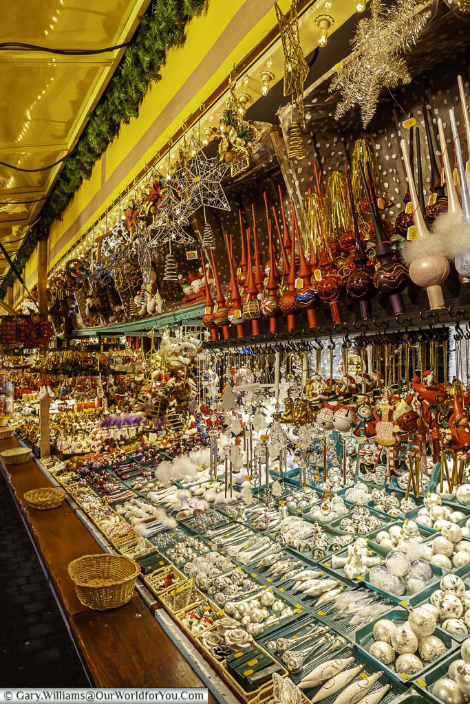 a stall on strasbourg's christmas markets selling baubles and tree toppers