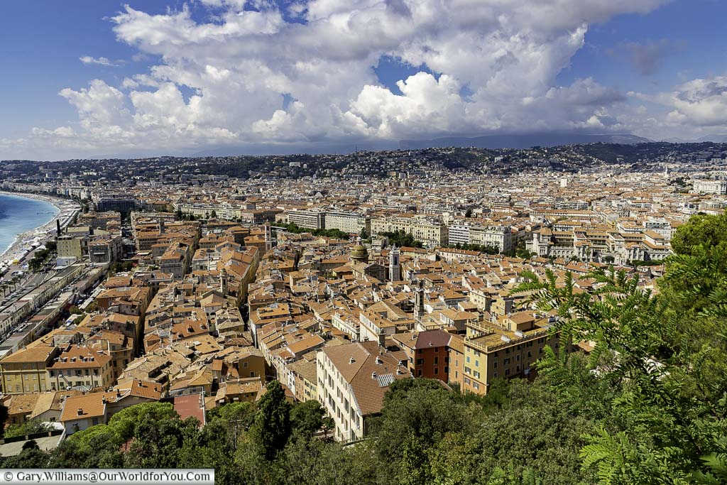 Overlooking Nice from Castle Hill with the orange tiled roofs of the old town and high provence hills in the background