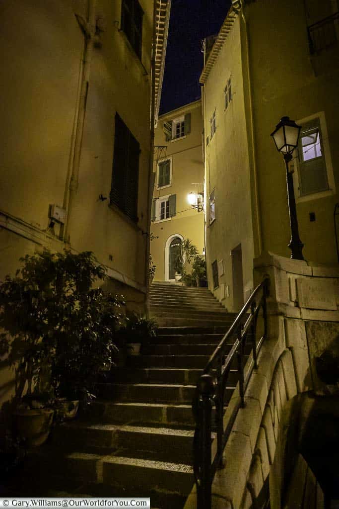 Steps leading up to a courtyard in Villefranche-sur-Mer at night