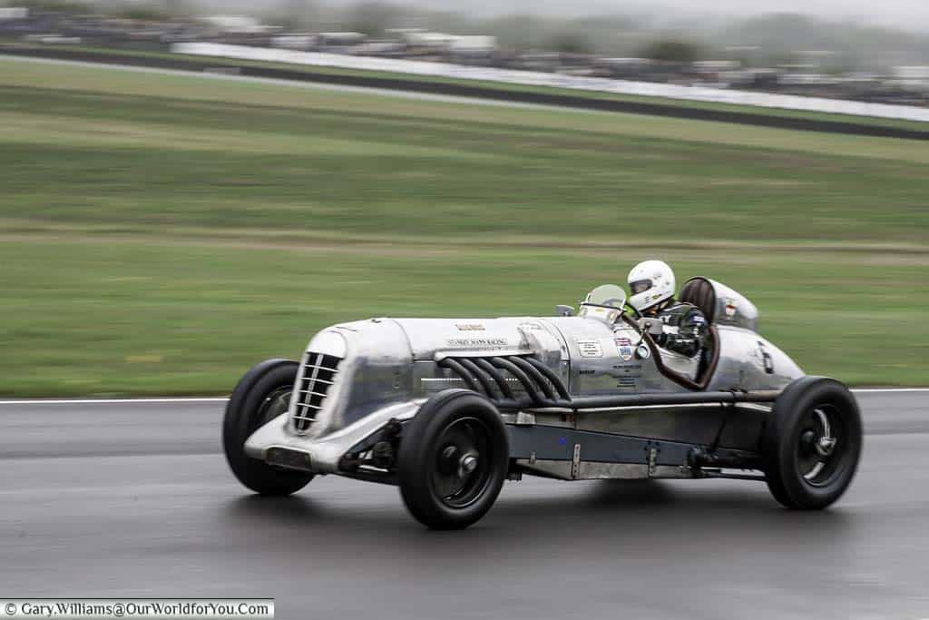 the 1927 bentley jackson special single-seater historic racing car at the on a grey overcast day at the goodwood revival meeting