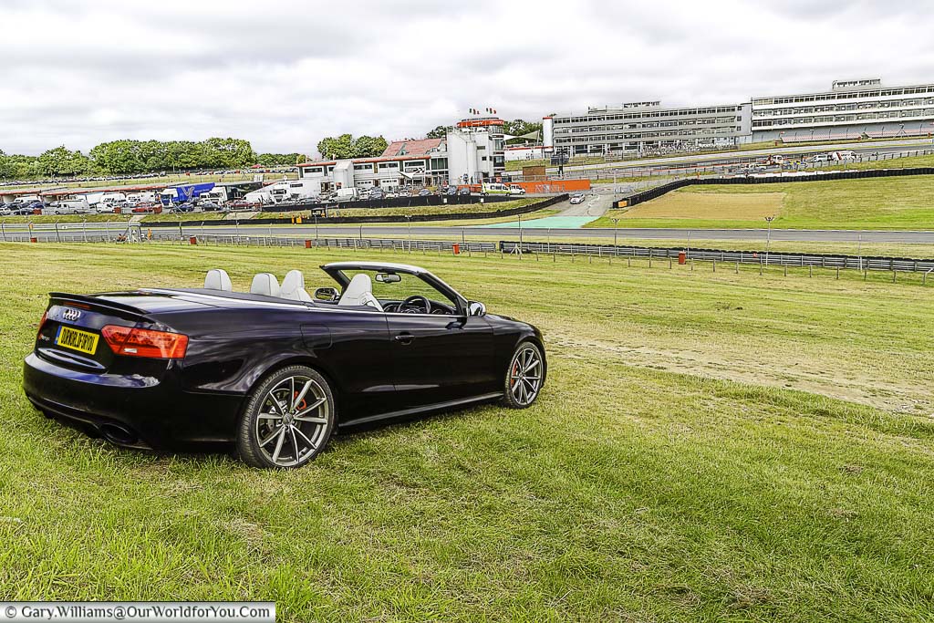 Our black audi rs5 convertible parked on south bank of brands hatch with its roof down overlooking the brands hatch circuit