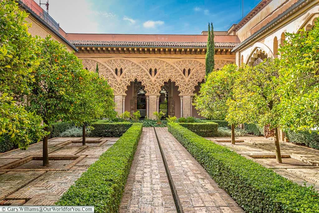 Trees planted out in a geomtric pattern in the Santa Isabel Courtyard in the aljafería palace in zaragoza, spain