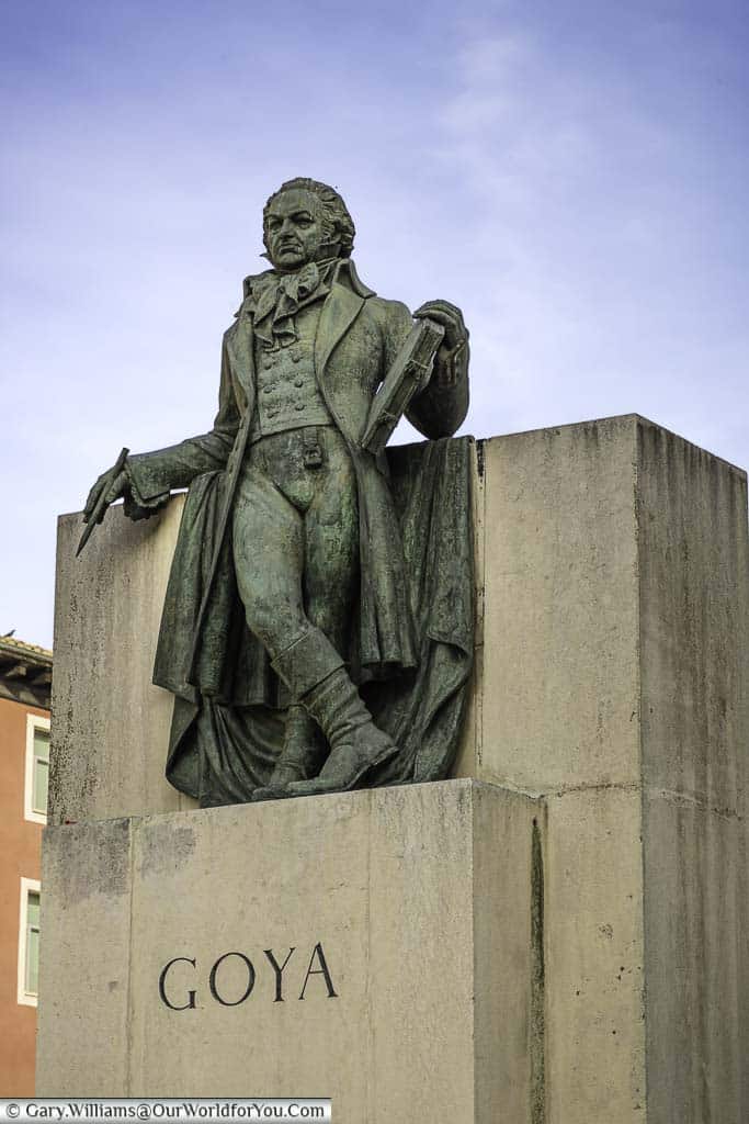 a bronze statute to the artist francisco de goya in the plaza del pilar in zaragoza