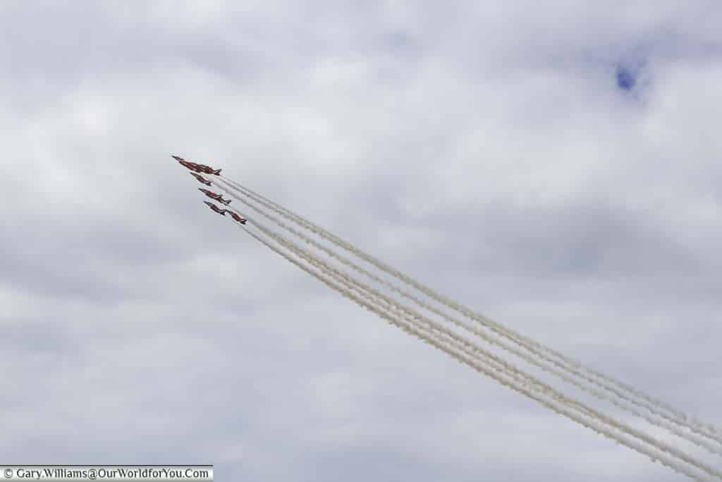The red arrow display team flying formation above the goodwood festival of speed