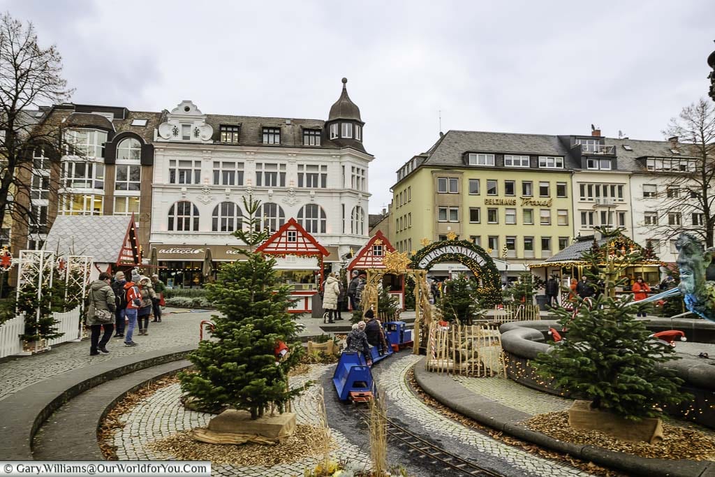 A miniature train running around the fountain in the centre of Görresplatz, part of koblenz's christmas markets