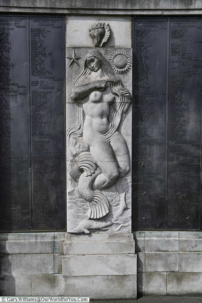 A base relief of a Mermaid between the list of the fallen at the Tower Hill Memorial in Trinity Memorial Gardens on Tower Hill
