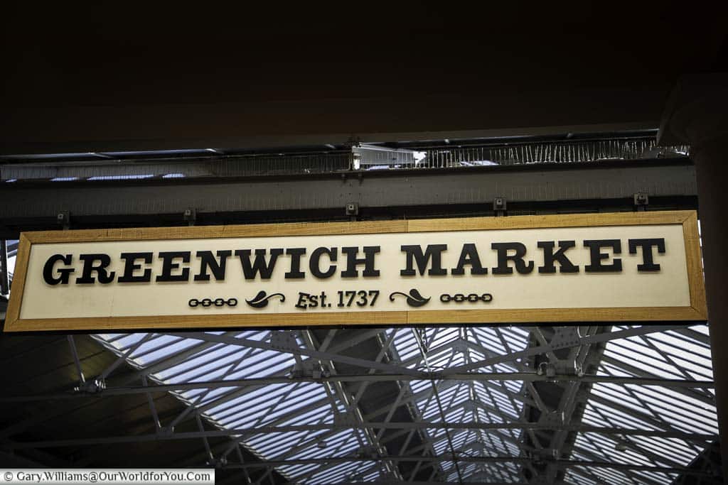 The greenwich market sign above the entrance to the main hall informing you it was established in 1737