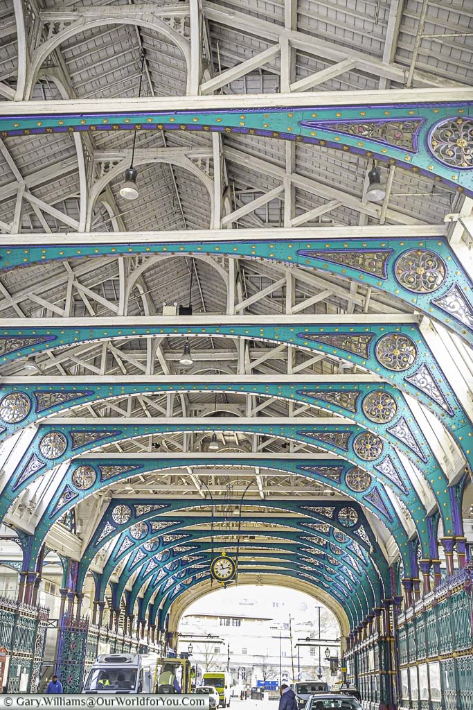 The ornate iron framework of the roof section covering main avenue in the centre of smithfield meat mark in the city of london
