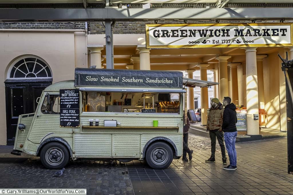 The food stall offering slow cooked barbecue sandwiches in Greenwich market being operated out of an old Citroen van