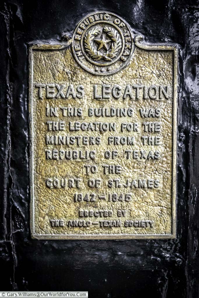 The brass Texas Legation plaque attached to an archway on St James's Street, City of Westminster, London
