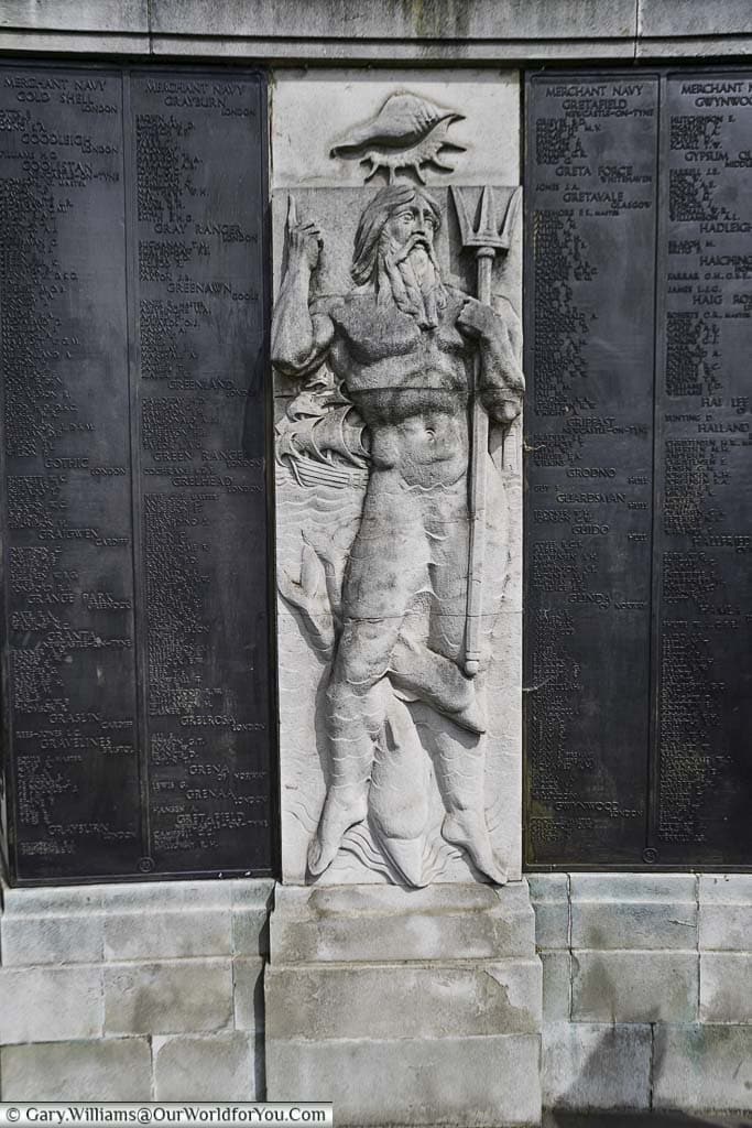 A base relief of Neptune between the list of the fallen at the Tower Hill Memorial in Trinity Memorial Gardens on Tower Hill