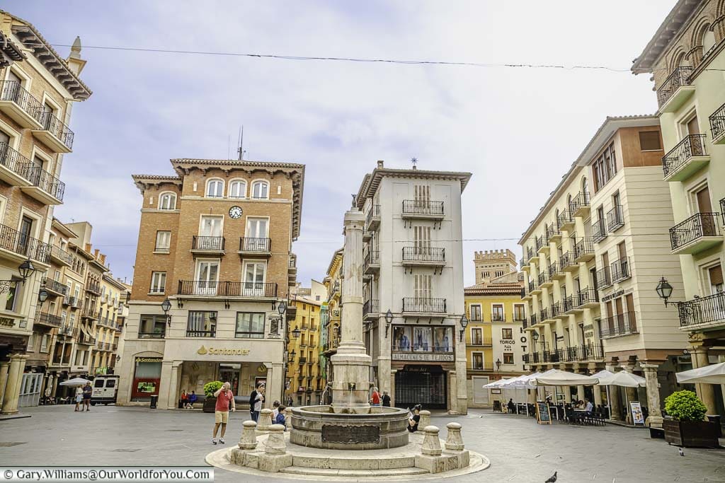 The torico fountain in the plaza del torico surrounded by elegant four storey town houses in teruel, spain