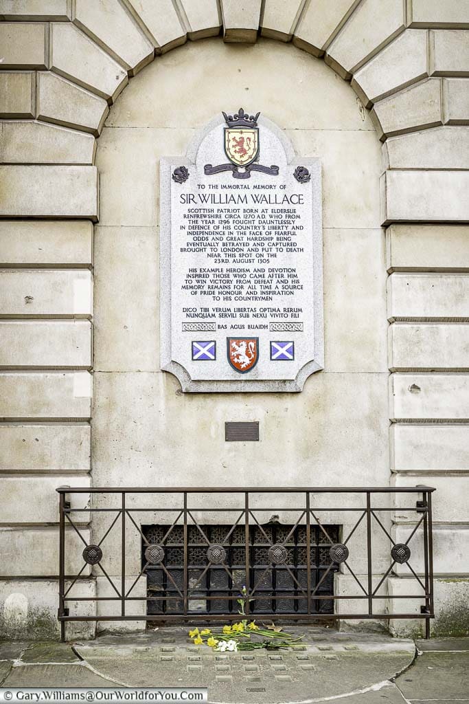 A stone plaque memorial to the Scottish hero Sir Williams Wallace, close to the spot he was put to death in the Smithfield district of the City of London