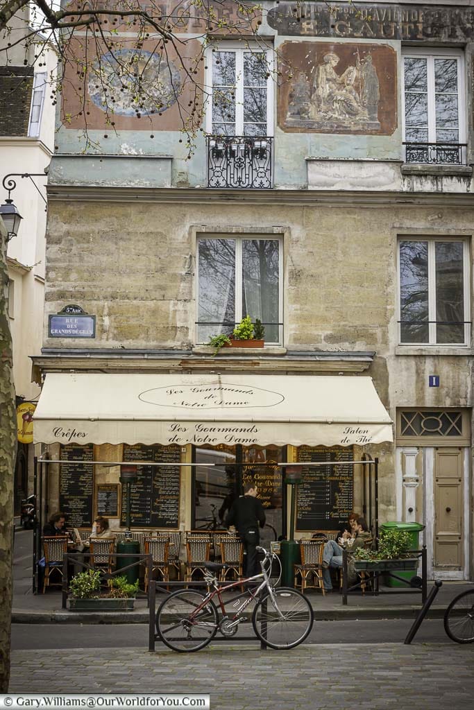 A small cafe in Paris, typical of France's capital.