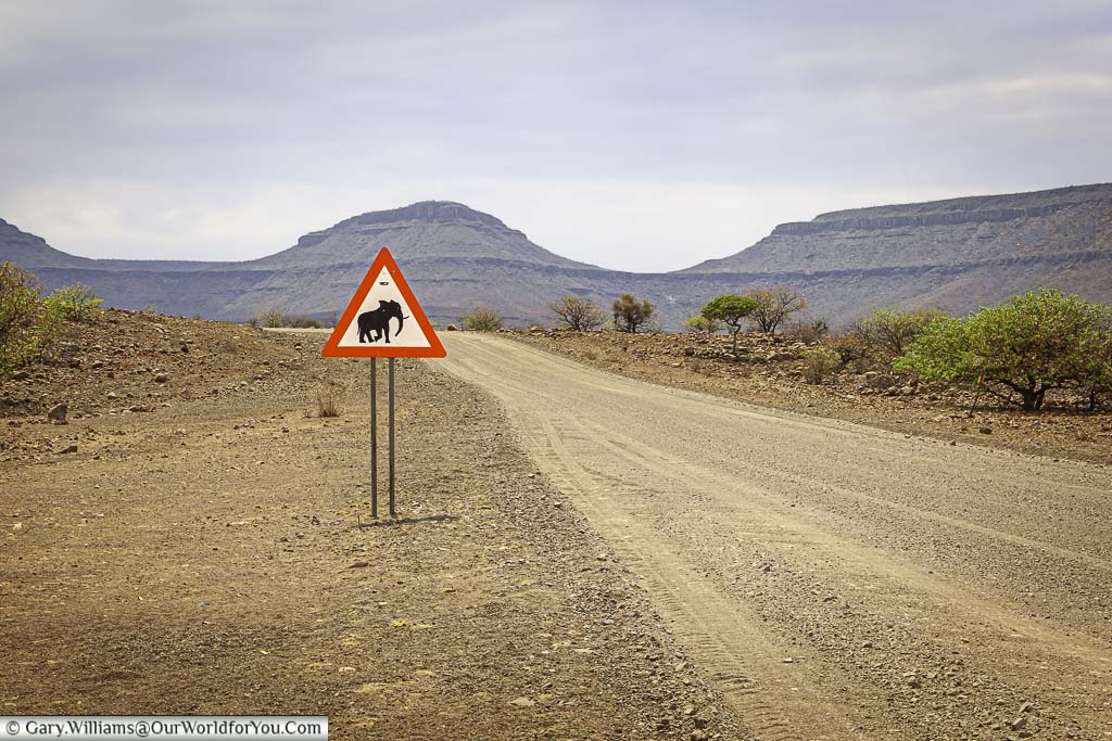 The beware of the elephant sign next to the dirt trail in damaraland in namibia
