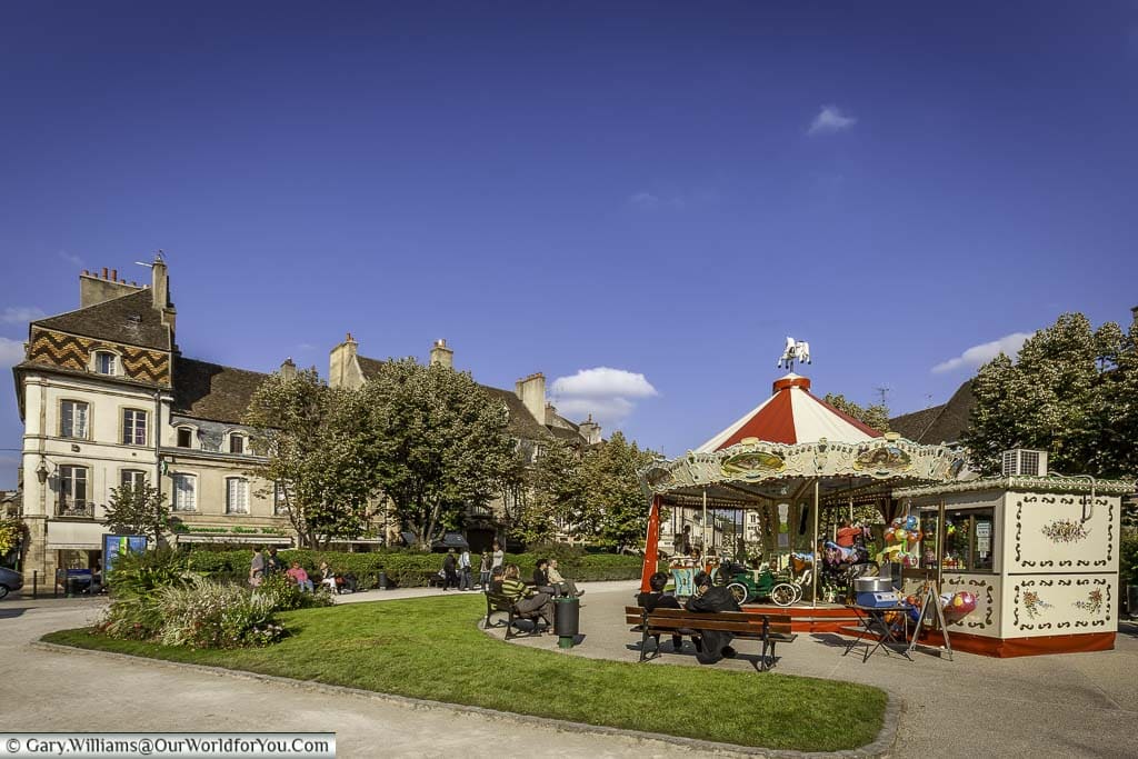 A traditional carousel in the peaceful Place Carnot in the centre of Beaune, in the heart of the burgundy wine region of France