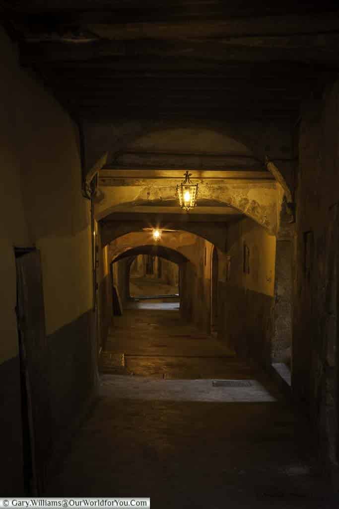 A dimly lit passageway of Rue Obscure in Villefranche-sur-Mer