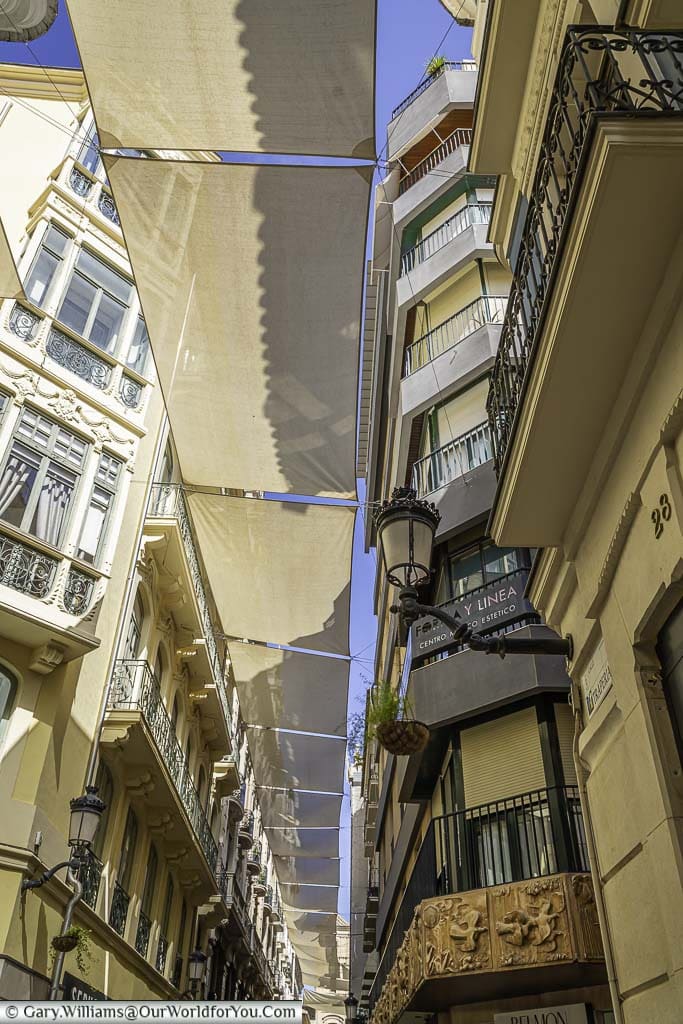 Sun screens over the whole length of calle trapería in murcia, spain