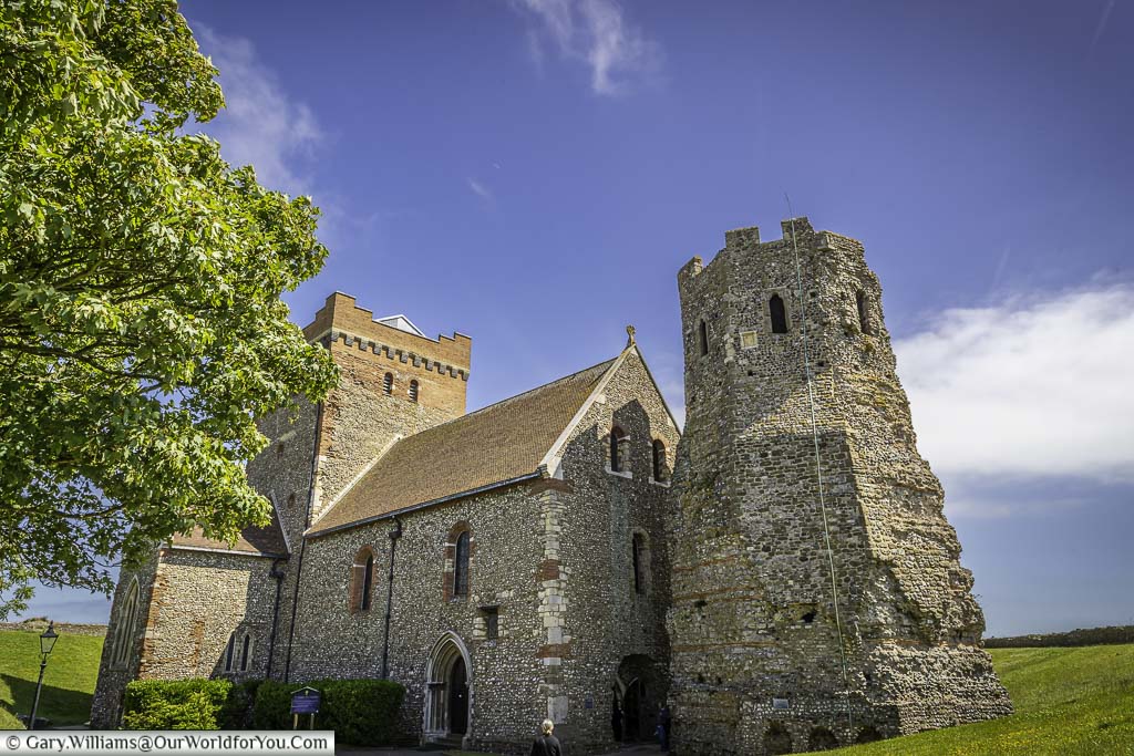 The church of st mary in the castle next to the remains of the roman lighthouse at the english heritage dover castle in kent