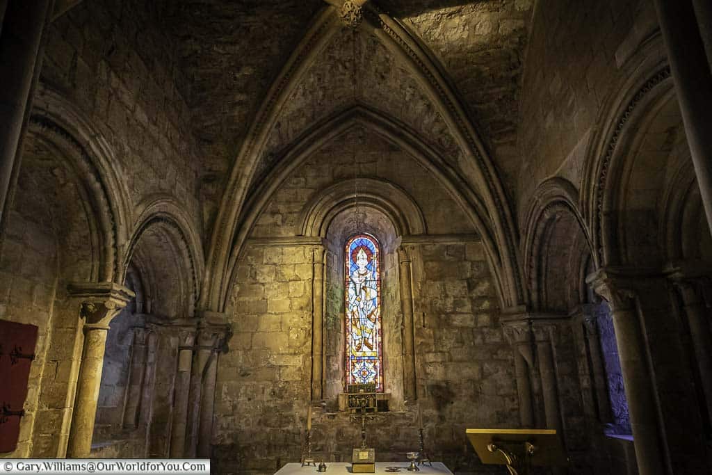 the vaulted chapel, with its stained glass window inside the great keep in the english heritage dover castle