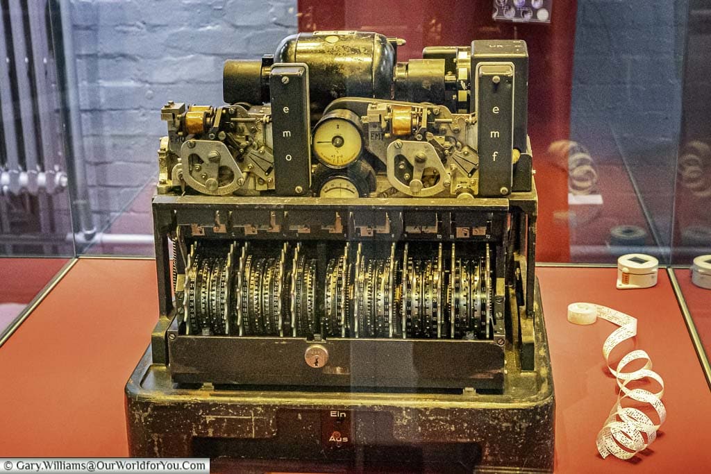 A captured cypher machine with its out case take off in a display cabinet at Bletchley Park